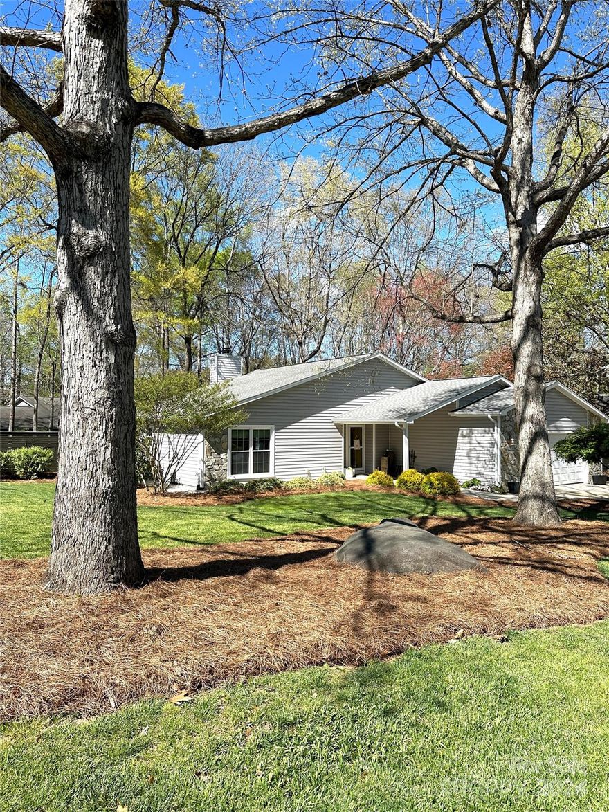 Fabulous renovated ranch on beautiful corner lot w/fully fenced back yard. Completely renovated 2023. Custom finished kitchen cabinets, granite countertop, SS appliances, sink, recessed lighting, and fixtures. Custom walk-in pantry. Inviting, light filled open floorplan offers large vaulted ceiling great room w/beautiful soaring stone fp. DR on front of house being used as an office. Kitchen has open eat in dining area. From the french doors step onto the custom pebbled patio overlooking large treed lot. Both baths taken down to the studs & magnificently renovated with lovely, sharp, modern finishes.Tile walk-in shower, penny tile floor, custom glass shower door, double vanity, new lighting & fixtures in primary. Hall bath complete w/tiled tub/shower, new vanity, marble hexagonal tile, new lighting & fixtures. Large primary en suite offers his and hers closets. 2 secondary bedrooms generously sized. AND a 2 car garage! Great S CLT location. Interior photos coming! Showings begin 4/19.