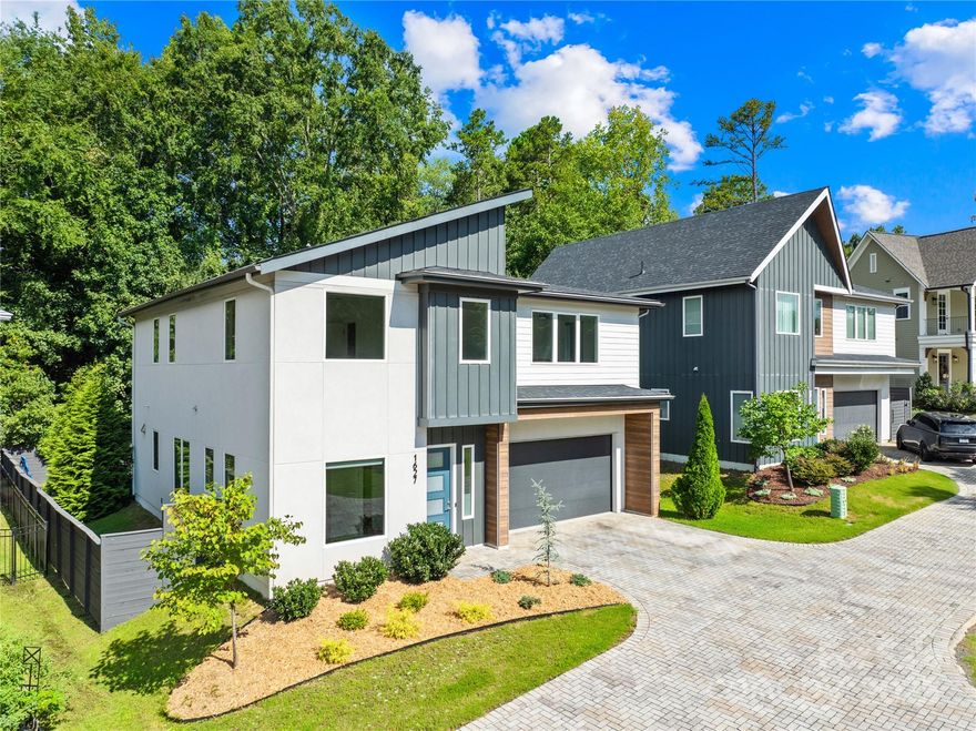 Stunning 4BR/3.5BA contemporary home in one of Charlotte’s most sought-after locations—just a short walk to parks, shops, and dining and uptown! Built with exceptional craftsmanship and eco-conscious details, including a permeable paver driveway. The spacious, fenced backyard offers rare privacy, mature trees, HOA-owned land directly behind ensures no future development.

Inside, enjoy a light-filled open floor plan with a dramatic foyer, open staircase, and a flexible office/playroom. The huge chef’s kitchen features European-style cabinetry, a large island, and expansive windows. Upstairs offers 4 spacious bedrooms each with walk-in closets, 3 full baths with floating vanities, and a central laundry room. Modern design meets everyday functionality—don’t miss this one!
