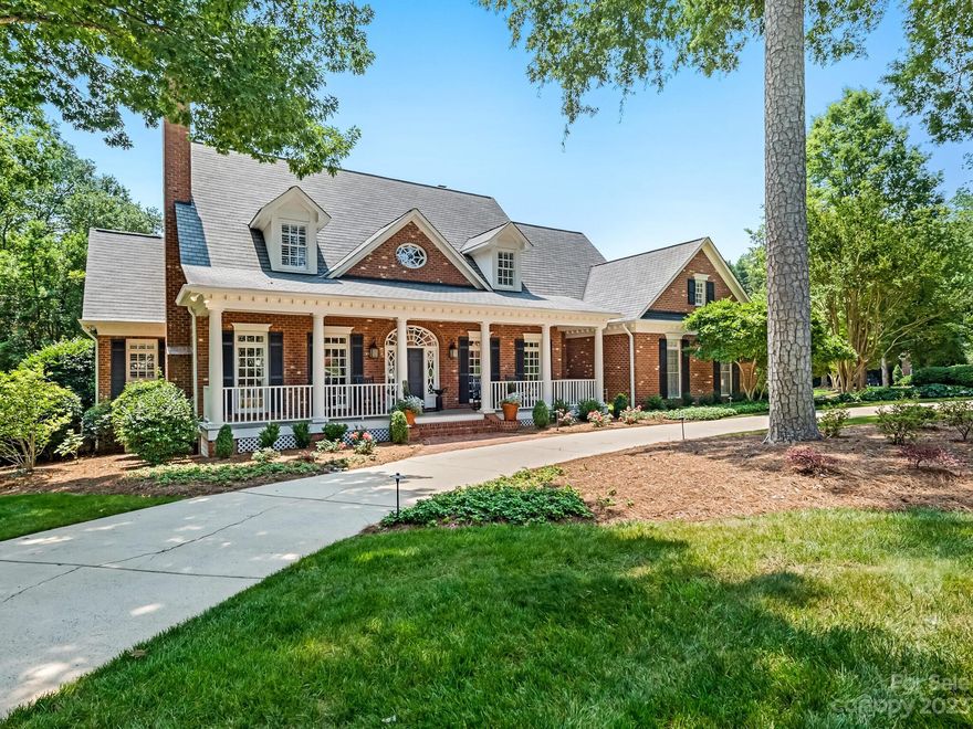 Beautifully maintained two story full brick home located on quiet cul-de-sac close to South Park, Cotswold and Uptown.  Lovely covered front porch leads to the gracious 2-story foyer flanked by formal living rm and dining rm w/butler's pantry & wet bar.  The fam room opens on to the beautiful covered terrace overlooking the brick patio with outdoor fireplace w/gas starter, built-in grill & beautiful formal garden complete with mature rose beds.  The kitchen has island with gas cooktop, stainless steel appliances, granite countertops and opens to the sunroom with wall of windows which allows for abundant sunlight.  The primary bedroom suite is on the main floor and opens onto the rear terrace. Lg primary bath w/walk in closet, shower and freestanding tub. Upstairs has 3 more bedrooms.  One is currently being used as an office and the bonus room could be a 5th BR.  Craft Rm/Studio offers great flex space. Pull down attic & walk in attic space. High ceilings 10' down & 9' up.