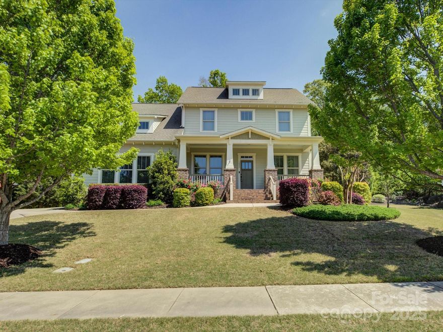 Welcome to your dream home in charming Fort Mill SC! From the moment you arrive, this beauty makes a statement with its expansive covered front porch that stretches the full length of the home—perfect for sipping sweet tea & waving to neighbors. Inside, it’s love at first sight. Gorgeous hardwood floors flow through the open floor plan while custom built-in shelving adds both style & function in the office. The kitchen? Total showstopper. Featuring granite countertops, a sleek tile backsplash, a built-in oven, & a spacious walk-in pantry, this space is made for entertaining & everyday living alike. The primary suite is your private retreat on the main floor, complete w/ a spa-worthy tiled walk-in shower that brings vacation vibes home. Need a little outdoor Zen? Venture out to your screened-in porch overlooking a private, wooded backyard—ideal for morning coffee, dinner al fresco, or just unwinding in nature. This home blends comfort, function, & modern elegance in one perfect package.