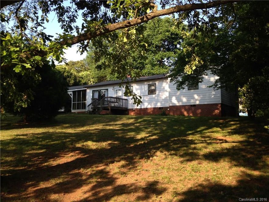 Great home with two car carport and screened in covered porch on over one and half acres. Hardwood floors, gas heat central air, good schools and a couple of storage buildings.  Priced almost $23k below tax value.  This one will not last!