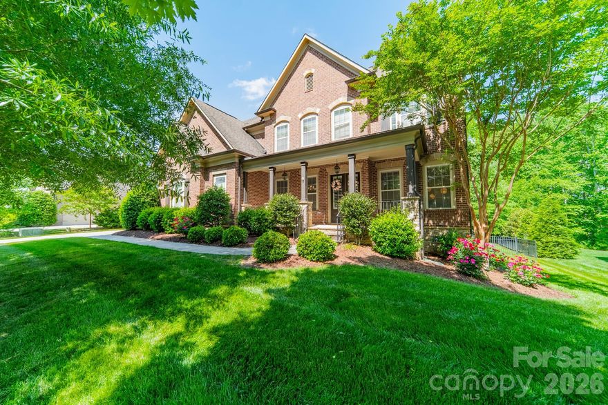 Built by renowned John Weiland Homes, this beautifully crafted home offers just under 5,000 square feet of thoughtfully designed living space with exceptional indoor and outdoor entertaining areas.

The spacious kitchen is the heart of the home with extensive granite countertops, an oversized center island, walk in pantry, and a keeping room that opens seamlessly to the living room with a gas log fireplace and built-in bookshelves. The main level also includes a full guest bedroom and full bathroom, formal dining room, and a flexible study or music room. The side entry offers a convenient drop zone complete with hooks, bench seating, and cubbies for everyday organization.

Upstairs, the second level offers four bedrooms and three full bathrooms, including the spacious primary suite with a large bathroom featuring a soaking tub, separate shower, and extra large his-and-hers closets.

The third level, finished in 2020, adds even more versatility with a large bedroom, full bathroom, expansive entertainment room, and additional flex space perfect for an office, gym, or craft room.

Outdoor living is just as impressive with a screened porch leading to a large paver patio featuring a built-in gas grill with granite counter space, a chimney fireplace, and above-ground hot tub with fully automated Covana cover. The backyard offers plenty of yard space along with mature woods for added privacy, creating the perfect setting for relaxing or entertaining year-round.