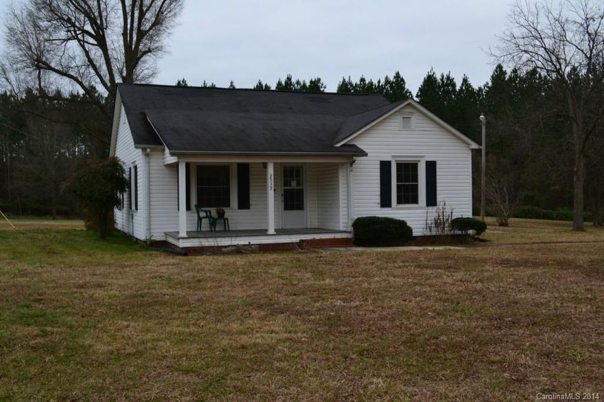 Charming country home on edge of Matthews with 2 acres of land. Priced well below tax value! Tongue and grove one inch hardwood flooring in LR,DR,all bedrooms. Large country kitchen with access to glass porch. Baths have ceramic tile floors, shower and tub surround. Two car detached garage plus a large separate storage building/workshop. Mature pecan trees along driveway. Convenient location and rare opportunity to experience country life within minutes of Matthews, Charlotte and Monroe.