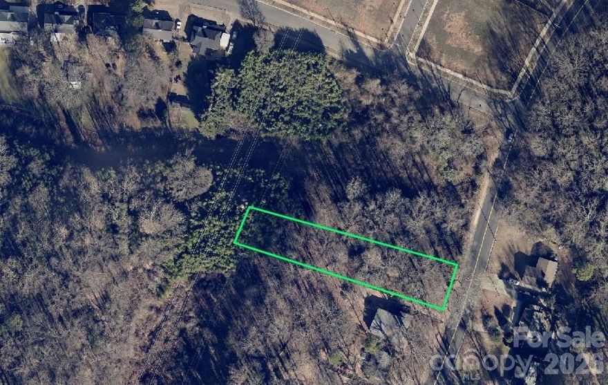 Over half an acre lot only steps away from Camp Greene Park and everything that this rapidly developing area has to offer.  Convenient to airport, Wesley Heights and just a few minutes from uptown. Lots of new construction in area.  Excellent opportunity to build wihile lot prices are still reasonable.  Please note utility right-of-way along the back of the property.