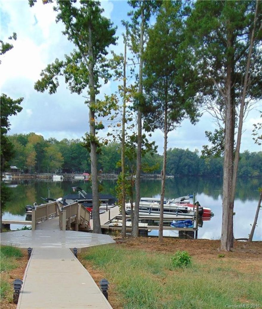 Beautiful Waterfront Condo- Truly a MUST SEE!  Deeded Boat Slip, 3 BR, 2 1/2 BA, SS Appliances (Drawer Microwave), Kitchen Counters/Imported Marble w/ Leathered Finish, you won't see this anywhere else.  Baths w/granite counter tops,  Custom Plantation Shutters on windows and doors to covered patio (3 point latch doors to patio).  View of the Lake from Great Room/Kitchen/Master BR. Dark Hardwood Floors. 2 Car Garage.Enjoy full amenities to Sunset Pointe on High Rock Lake, 2nd Largest Lake in NC.