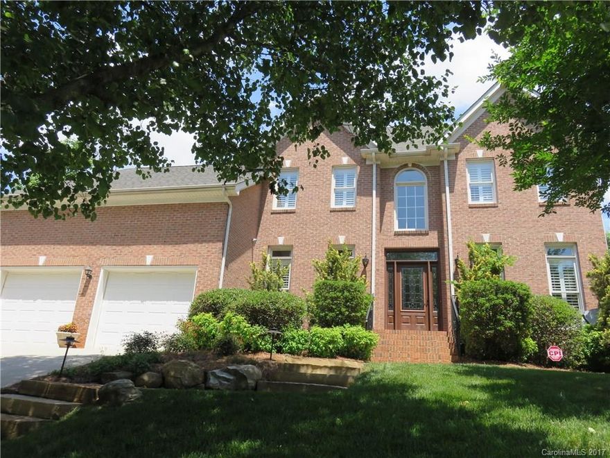 Wow! Beautiful full brick home has everything from the in-ground free form heated gunite pool with stone backdrop & waterfall, pergola fire pit area, and expansive decorated stamped concrete to the granite Kitchen, Wood floors/stairs down, crown moldings, glass enclosed backyard porch (225 sq ft) w/ rich wood ceiling, vaulted entryway, custom front door, stone walkways, security system, master bath w/seating area & tiled 2 head shower, large bonus rm w/ extra storage, guest bdrm down & MORE