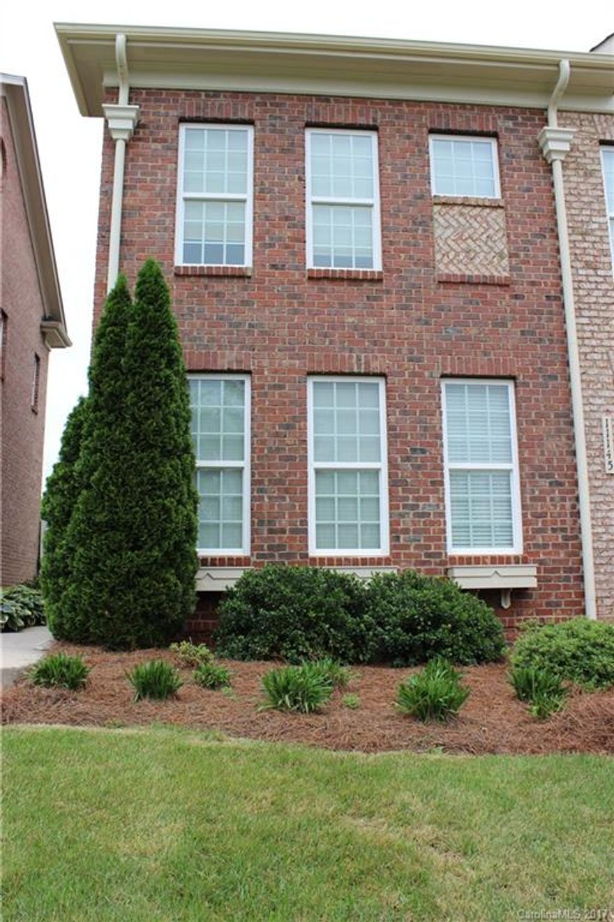 END UNIT Bright & open 2 story all brick townhome in fantastic Ballantyne location. Walk to restaurants, shops, Harris Teeter, & more! This 2 bed, 2 1/2 bath home boasts hardwoods on main, wide crown molding, wainscoting, granite in kitchen and both full baths, walk in closets & more! Small fenced backyard with new patio attaches to the one car garage for lots of storage. Beautiful area just a few mins from 485 and less than a mile from 485- included cable, internet, washer & dryer & lawn care!!