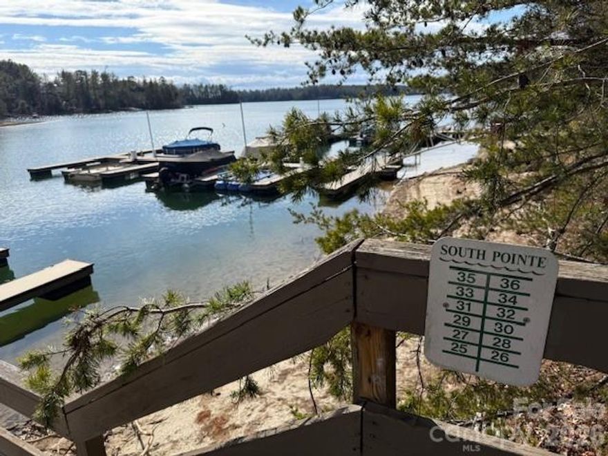 Experience the pinnacle of lakeside living with this exceptional 1.8-acre corner lot nestled in the prestigious Southpointe community. This level, wooded homesite offers the perfect canvas for your custom dream home, combining ultimate privacy with premium neighborhood amenities.
- Deeded Boat Slip: This lot comes with a coveted deeded boat slip (#34), providing immediate and permanent access to the crystal-clear waters of Lake James.
- This lot is on city water and city sewer! Enjoy full access to the Southpointe clubhouse, community pool, wide roads/street lights, and peaceful walking trails. Southpointe is minutes away from Lake James State Park, the popular Fonta Flora Brewery, Bones Jones Restaurant, world-class mountain biking and hiking trails, and only 15 minutes to downtown Morganton.
Whether you are looking to build a full-time residence or a weekend retreat, this property offers a rare opportunity to join one of Morganton’s most sought-after waterfront Lake James communities.