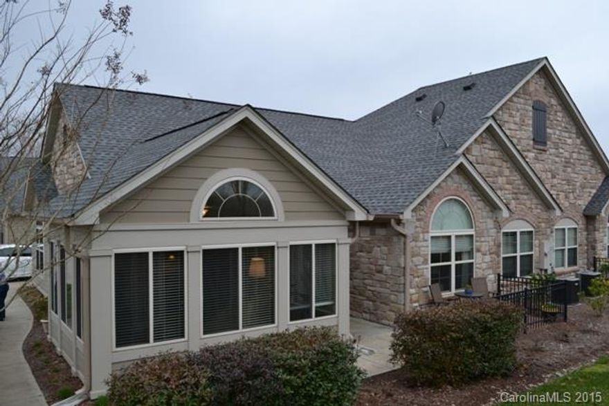 Absolutely gorgeous condo with $40,000 of upgrades!  The unit is the Canterbury floor plan. Beautiful granite kitchen with stainless appliances, gas range, wince rack, breakfast bar. Vaulted great room with fireplace/gas logs, vaulted sun room and office.  Split bedroom plan, laundry room with large storage closet.  New roof in 2012 and new gas furnace in 2013.  Great access to shopping, restaurants and I-77.  Neighborhood has club house and pool.