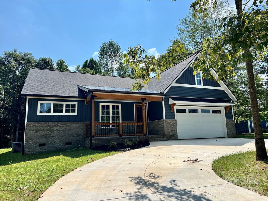 Charming custom new construction home in Archer's Ridge! This modern farmhouse home features 3-bedrooms, 2.5-bathroom and a flex-space! This space would be an ideal as an office, playroom or craft room. The home has 9 foot ceilings and a vault great room. The kitchen has custom cabinetry, quartz countertops, a large kitchen island with wrap around bar seating and a gorgeous pantry. The living room has built in cabinetry, a beautiful view of the backyard and a custom fireplace with an electric insert. The primary bedroom has two walk-in closets and a luxurious bathroom with double vanity, custom shower, and heated tile floors. The property also features a 16x10 rear deck with privacy screen, a 2-car garage, mature trees, and a circle driveway. This home is located 15 minutes from Mocksville or Statesville and 35 minutes from Winston Salem. Home has been pre-inspected!