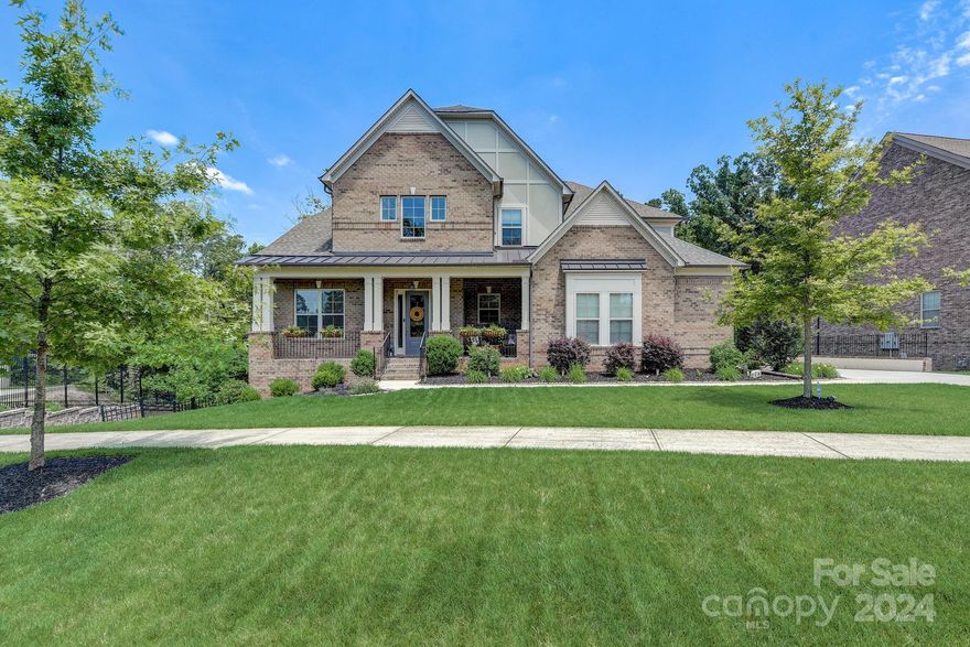 Welcome to your dream home! This meticulously crafted residence boasts an open living concept on the main level, featuring a gourmet kitchen, adjoining breakfast area offering panoramic views of the backyard. The main level also includes a dedicated office space, formal dining room, secondary smaller office and guest suite.  A laundry room and mudroom just off the garage provide added practicality and organization. Upstairs, the luxurious primary suite awaits, complete with a sitting area, custom closet space, and a spa-like ensuite bath. The upper level offers a spacious loft area, three additional bedrooms, two full baths, and a convenient laundry closet. The finished basement is an entertainer's delight, featuring new LVP flooring, a generous rec room and an additional guest suite for extended stays.  Step outside to the inviting veranda, where you can unwind in the hot tub while surrounded by the tranquility of the natural wooded area.