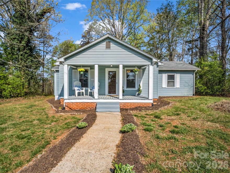 This stunning three-bedroom, two-bathroom residence is nestled on 1.28 acres, offering endless possibilities. Tucked away towards the end of a dead-end road, this retreat boasts an inviting front porch is perfect for relaxing in a porch swing or rocking chairs. The kitchen has been beautifully renovated with dark countertops and brand-new appliances, including a sleek stainless steel sink. As a bonus, all appliances are included in the sale of the home. Fresh paint throughout the home adds a bright and airy feel. Both bathrooms have been stylishly updated, with one featuring a tub and shower combination, and the other featuring a convenient step-in shower. The laundry facilities are conveniently located inside the home, with an outside access door on the spacious porch. Recent updates include a new roof in 2023 and a new propane hot water heater, providing peace of mind for the new owner. The dual propane heating and air unit was also updated in 2019, ensuring a comfortable living space. City water available but would need a tap added.