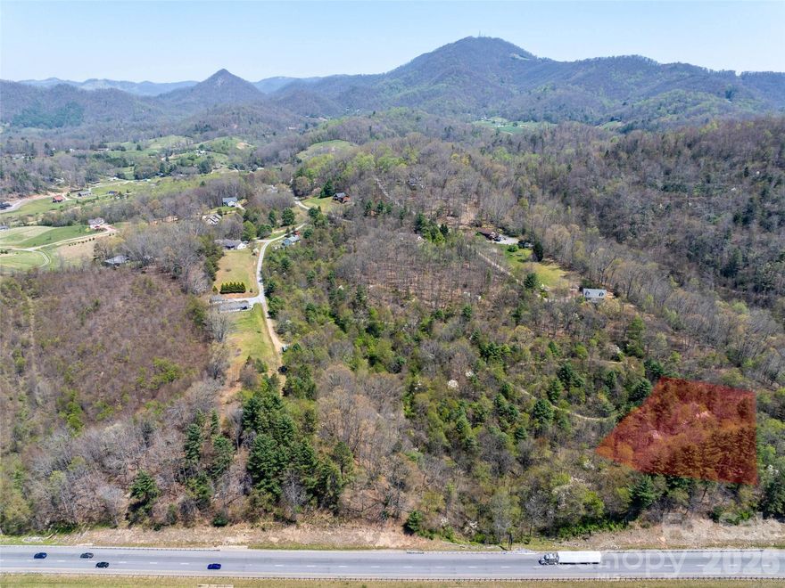 Discover the perfect mountain retreat with this beautiful 1.64-acre home site located in the desirable Hyder Mountain Acres subdivision, nestled in the heart of Haywood County and the scenic Blue Ridge Mountains. With selective trimming, the property boasts stunning panoramic views—ideal for enjoying the peaceful mountain setting. Conveniently located near I-40, this lot provides quick access to Asheville, Tennessee, and all that Haywood County has to offer. The subdivision requires only a 1,000-sqft min build, offering great flexibility for your home design, manufactured not allowed.