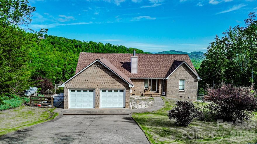 Enjoy long-range mountain views from this 3BR/2BA brick home on 5.81 private acres in Golden Valley Estates. With 1,530 SF of one-level living, a 2-car attached garage, 2024 architectural roof, and whole-house generator, this property offers the mountain setting buyers want with the practical features they need. Fireplace, vinyl plank flooring, paved road access, well and septic, and included kitchen/laundry appliances add to the appeal. A strong value for buyers seeking privacy, durability, and everyday comfort in a scenic setting. Offered at $379,900.