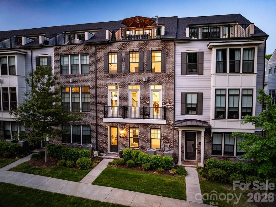 Turnkey four-story luxury townhome in the desirable Elizabeth Glen community, offering pristine condition and an exquisite neutral palette throughout. Enter through the garage that features epoxy flooring, opens to a first-floor drop zone, foyer, and private bedroom with full ensuite bath. The main floor boasts generous formal spaces that flow to a chef-inspired kitchen featuring a KitchenAid 6-burner range, ceiling-height soft-close cabinetry, and a statement island with abundant storage. A private covered balcony, plus a sophisticated, custom bar behind double glass doors create seamless indoor-outdoor flow on main. Third floor offers The serene primary suite with sprawling spa-inspired bath and custom closet, plus third bedroom and ensuite bathroom. The fourth floor provides flexible ensuite space currently used as an office and exercise area but could be used as bedroom, opening to a balcony and leading to a rooftop terrace. The home is fully wired with ceiling-mounted speakers on all levels, individual room volume controls, and two outdoor terrace speakers that will remain with the property; the amplifiers will not convey. Enjoy added privacy with a tree-lined street view rather than overlooking neighboring homes. This residence seamlessly blends luxury upgrades, privacy, and modern convenience across four exceptional levels.