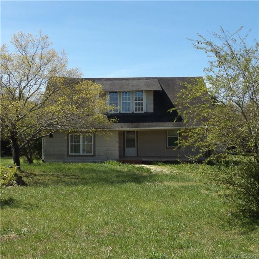 Rare find.  Beautiful 1.11 ac lot located in the Mt. Pleasant School district.  Peaceful country setting with fenced in back yard and separate pasture areas and storage buildings.  House is in need of major repairs and is being sold "AS IS".