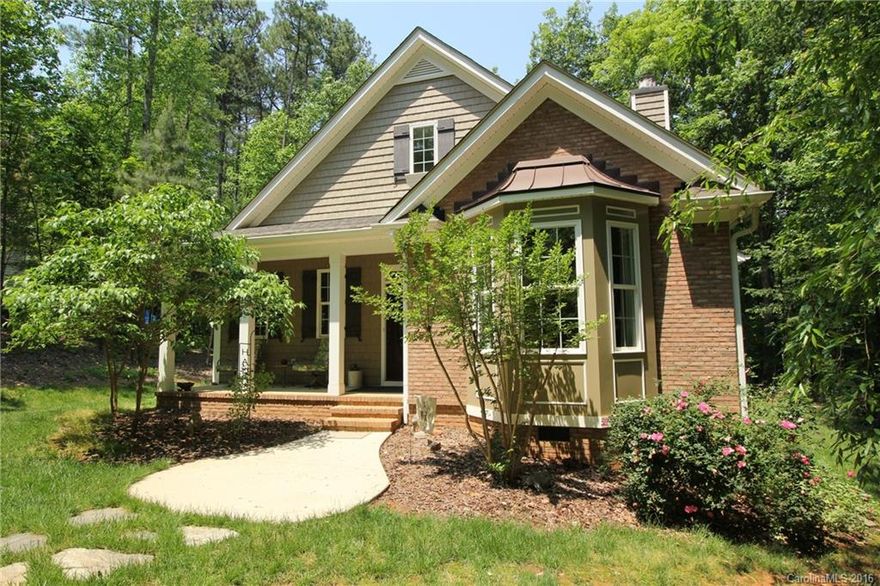 UPSCALE smaller home! 2bd/2full baths on a grand scale...Lg covered side porch (176 s.f.) w/skylights, ceiling fans,  and a "forest" like view! Interior boasts Hickory hardwood floors, Granite, Jetted Master Tub,  Dacor oven; Bosch cook top, micro & dishwasher; Kitchen Aid SS ceiling range hood; prewired stereo speakers, surround sound & security system; loft w/operable skylight.... must see to appreciate the custom quality of this home!