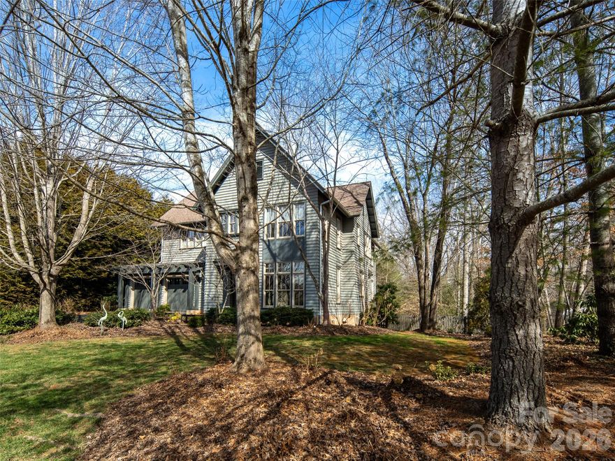 Stunning upscale custom home on a spacious corner lot! This one of a kind home was designed by a respected local architect as his personal home! The exterior detail and finish harkens back to the original homes of Ashevilles historic Montford neighborhood while the interior offers a modern flair with clean lines and timeless materials. The main level is open and filled with natural light! Upstairs the bedrooms are spacious with ample closet space, well appointed bathrooms, and a coffee bar. don't miss the large private deck off the primary bedroom! The finished lower level is ideal for a guest suite, office, den, or library and also offer huge storage areas! Outdoor living spaces include a charming covered veranda, deck, stone patio with fire pit within the large fenced rear yard! Close to the lake, clubhouse, trails, boating, concerts, events, pickle ball, tennis, and everything else Biltmore Lake has to offer!