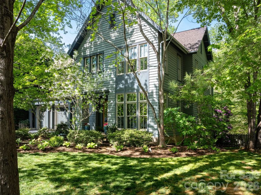 Stunning upscale custom home on a spacious corner lot! This one of a kind home was designed by a respected local architect as his personal home! The exterior detail and finish harkens back to the original homes of Ashevilles historic Montford neighborhood while the interior offers a modern flair with clean lines and timeless materials. The main level is open and filled with natural light! Upstairs the bedrooms are spacious with ample closet space, well appointed bathrooms, and a coffee bar. don't miss the large private deck off the primary bedroom! The finished lower level is ideal for a guest suite, office, den, or library and also offer huge storage areas! Outdoor living spaces include a charming covered veranda, deck, stone patio with fire pit within the large fenced rear yard! Close to the lake, clubhouse, trails, boating, concerts, events, pickle ball, tennis, and everything else Biltmore Lake has to offer!