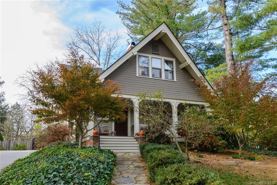 Quintessential Arts & Crafts home nestled on a commanding knoll in Historic Montford. This property exudes the warmth & historic charm of period details that are tastefully wed with the comforts of modern updates. Inviting floor plan with cook’s kitchen boasting custom Mission style cabinetry, granite, and steel. Luxury baths with classic tile, glass and chrome. Views of mountain sunrises from covered front porch and sunsets on back deck. Backyard cottage offers an extra space for rest or play.