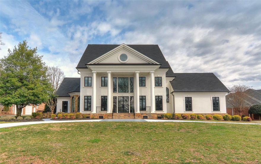 Fabulous renovated home in The Peninsula overlooking the 6th Hole!  Circle drive stuns with tall glass front door.  Freshly painted exterior, new gutters,  new windows, & travertine back porch on golf course.  Herringbone pattern entry white oak flooring & custom staircase w/ metal railings are a show stopper!  New hardwood flooring thru 1st & 2nd floors.  New designer lighting, doors, casing, & trim throughout.  Chef's kitchen with new cabinetry, marble & quartz countertops, duel fuel 48 in range, coffee bar, & beverage/wine coolers.  1st floor Primary features walk in shower, soaking tub, & custom closet w/ island leading to side & back patios.  Second floor features 3 additional bedrooms and 4th room could be second bonus room or in law suite w/ full bath!  Third story is over 1500 sq ft with massive bonus space/workout room & 2nd kitchen area featuring dishwasher & beverage cooler.  Expect to be impressed w/ this beautiful lot & new interior home.  Come take a tour today!