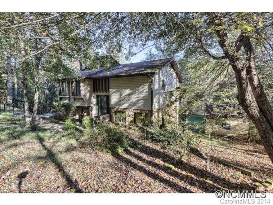 Lovely 1.65 acre park-like setting.  All glass heated Sunroom overlooks neighborhood pond/park.  Main level features open living/dining rooms with stone fireplace plus master suite and deck.Lower level offers family room, 2 bedrooms, full bath and large laundry room.  Excellent parking.