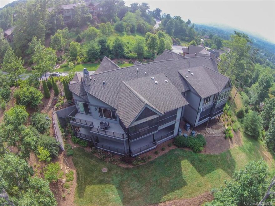 Fantastic year round views from bedrooms in this gorgeous lodge style townhome. Over 1300 sq feet of decking with a large screened in portion with gas log fireplace. Hardwoods in all living areas. Small gated courtyard for kids or pets. All bedrooms have private baths, large 20x15 space ideal for media room.  Gourmet kitchen with Upgraded Viking appliances.Just added: encapsulated crawlspace, UV light air filtration, 2 stage whole house water filtration system.Easy living with private elevator.