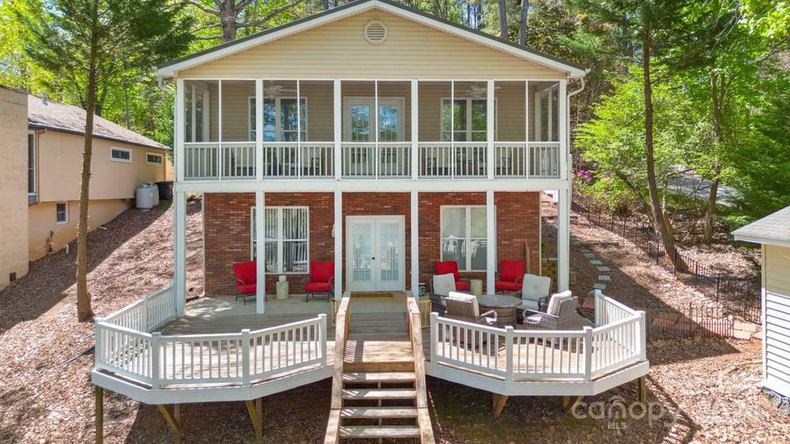 Nicely furnished waterfront home nestled in the trees that provide glorious shade! Fantastically deep, deep water & large 2-Slip Boathouse w/ personal watercraft lift. Full open sundeck on top perfect for sunbathing. This floorplan features a beautiful open great room, kitchen w/ painted cabinetry & center island, dining area with beautiful lake views, and a large screen porch looking over the lake! Primary bedroom & large full bath with garden tub and separate shower located on the main floor! Downstairs in the finished basement, you have a nice size bedroom and a bonus room to use any way you'd like and another full bath. The tall ceilings gives the basement a lovely open & airy feel! Nice den with lots of windows and glass doors that connects to a beautiful covered patio and two open octagonal decks that flank each side of the walkway leading directly to the waters edge. Just a fantastic setting, with a wonderful view of the lake. New HVAC, New Sea/Shore Wall, Metal Roof Aprox 2018