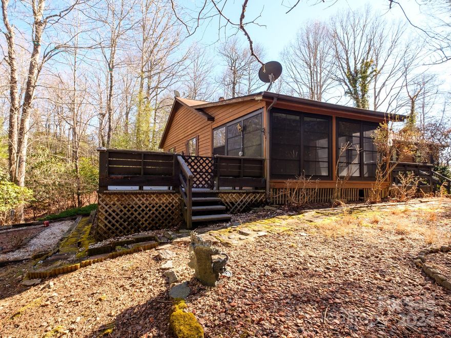 Fixer upper with tons of potential. This home sits on a level lot and features 3 beds and 2 baths and a wood burning fireplace, all on one level. The bones look solid and it has an incredible location. The home sits perched on a slight knoll overlooking Lake Ticoa and right across the street from the lake. There is a path across the street that leads down to the lake. This could be a great flipper or a personal project to create the perfect mountain cabin in Connestee Falls. As an owner in Connestee you have access to over 20 miles of pristine hiking trails, 6 waterfalls, 4 lakes totaling over 230 acres of lake frontage, an 18 hole designer golf golf course, pickle ball, tennis, pool facilities and multiple top notch food and beverage options. We also have a new Health and Wellness center that should open in April 2024! Buyer to pay one time aAmenity Fee of $13,000 at closing.