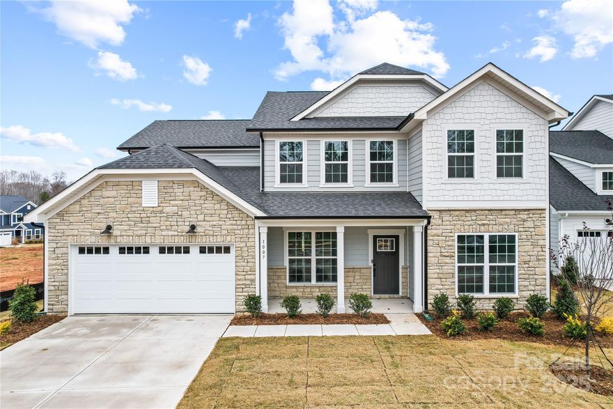 Welcome to this stunning new construction home nestled in the heart of Waxhaw, NC. Thoughtfully designed with both comfort and functionality in mind, this spacious residence offers 5 bedrooms and 4 full bathrooms, perfect for today’s modern lifestyle. The main level has a Gourmet Kitchen with huge island. A guest suite on the main floor adds versatility and convenience for visiting family or friends. Enjoy your private outdoor view from the Sunroom located off of the Gathering Room. The upper level features an elegant primary suite complete with a spa-inspired en-suite bathroom and generous walk-in closet, providing a private retreat for homeowners. Upstairs, you'll find three additional well-appointed bedrooms, along with a large loft ideal for a media space. Located just minutes from Waxhaw’s charming downtown shops, dining, and top-rated schools, this home offers the perfect blend of small-town charm and modern elegance.