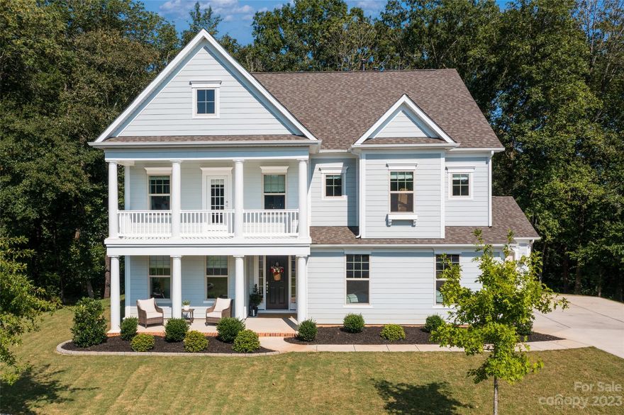 Looking for a home with southern living charm? This is the ONE! This stunning property combines luxury living with the versatility of an adjacent lot, perfect for expanding your outdoor space or to create a beautiful garden. Step inside this immaculate home & be wowed by the spacious 5 bdrms, 3 full bathrooms & open-concept living areas that make entertaining & relaxing a breeze. The kitchen features granite countertops, gas cooktop & huge island, while a main floor bedroom & full bathroom offer guest accommodations. With a sprawling 3,208 sq ft of living space, this property offers ample room for all of your needs. The 3-car garage provides plenty of storage space & secure parking, while the large windows throughout the home invite in natural light & stunning views of the surrounding area. Nestled in a new, up-and-coming neighborhood, you'll enjoy the peace & tranquility of suburban living while staying close to all the amenities you need, including shopping, dining & entertainment!