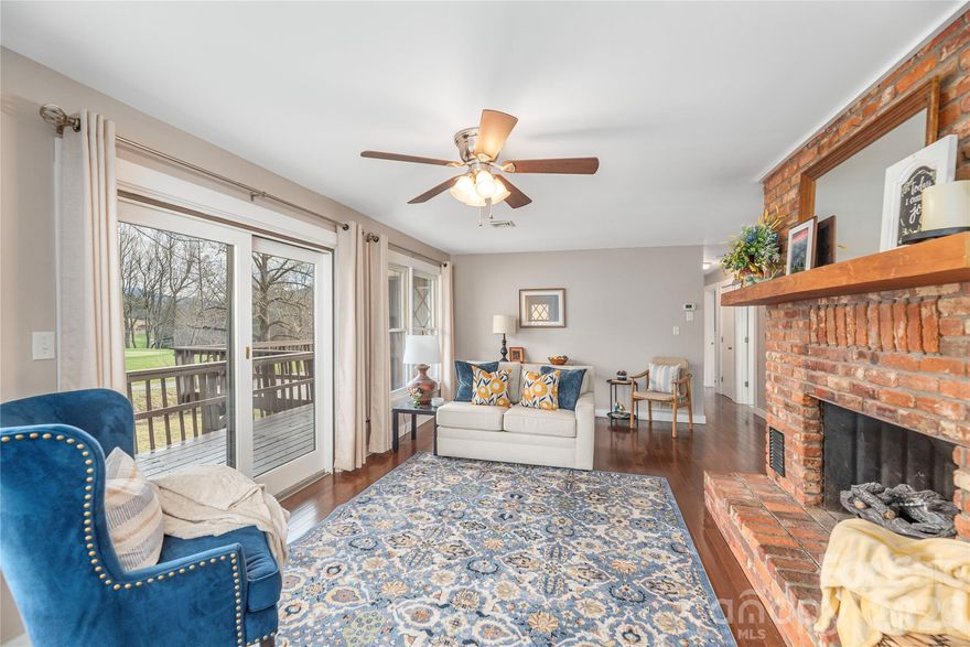 Welcome to refined mountain living inside the gated community of Springdale Estates/Country Club. Perfectly positioned on a picturesque 0.57-acre creek front lot overlooking the 17th hole, this beautifully maintained 4BR/3BA home offers 2,469 sq ft of comfort, space, and serene surroundings.

Inside, natural light fills the home, highlighting vaulted ceilings and a seamless flow between living spaces. The inviting living room features a gas fireplace and opens effortlessly into the dining area and well-appointed kitchen, complete with a skylight, modern appliances, and a gas cooktop-ideal for both everyday living and entertaining.

While the main-level provides a peaceful retreat, complemented by additional bedrooms and flexible living space to accommodate family, guests, hobbies, or a home office, it also showcases a laundry room and oversized two-car garage.

The fully finished lower level offers even more versatility with a second living area, wood burning fireplace, bonus room, workshop/storage space, and convenient walk-out access.

Outdoor living truly shines with both upper and lower decks overlooking the gently flowing creek and golf course beyond. Whether enjoying quiet mornings with coffee or unwinding at sunset, the setting creates a sense of calm that's hard to find.

Residents of Springdale enjoy access to exceptional amenities, including a championship 18-hole golf course, clubhouse, outdoor heated pool, spa, fitness center, and more (membership optional). As an added benefit, sellers are offering up to $5,000 toward the buyer's membership initiation fee, creating an opportunity to fully enjoy the country club lifestyle from day one. 

All just a short drive to downtown Canton and Waynesville, offering the perfect balance of privacy and convenience. This is an opportunity to experience mountain living at its finest - where nature, comfort, and lifestyle come together. 

Sellers also have an additional 0.43 acre lot for sale within Springdale that is ready to be built on and has already been perked for a 3 bedroom/2 bath home. MLS #4344046