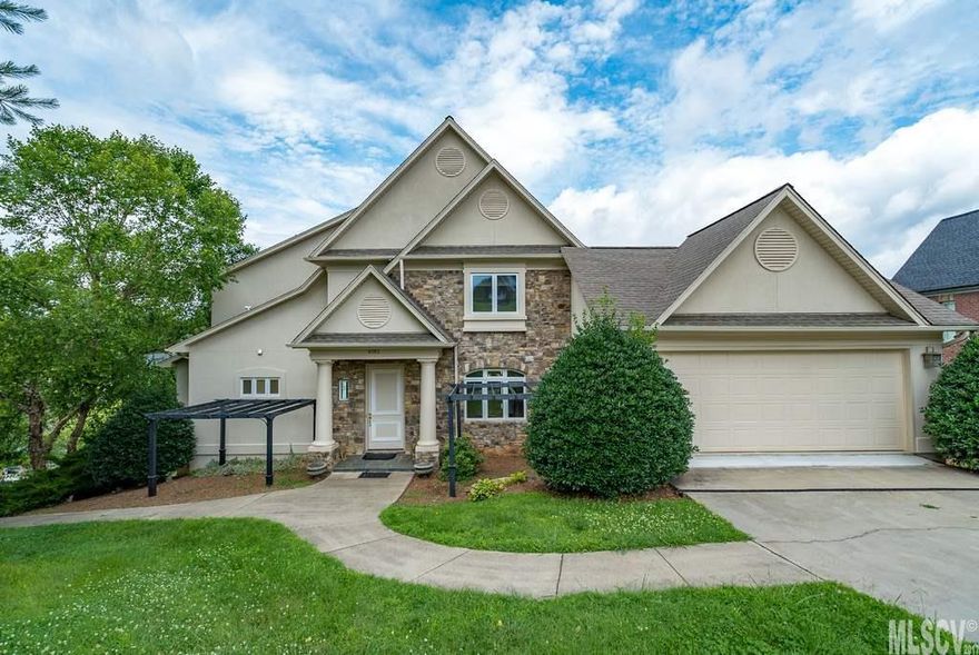 Have you dreamed of lakefront living? Look no further then this Lake Hickory main channel home! This home is located in a quiet cul-de-sac in Hickory's Gated Community of Moore's Ferry. Main level features master suite,living room with gas logs, dining room perfect for entertaining, and gourmet kitchen recently updated with granite counters, stainless steel appliances, and loads of storage. master suite features gas log fireplace, over-sized master bath with separate shower and tub, dreamy closets, and picturesque views of Lake Hickory! Second level offers large flex space perfect for a play room or den, three bedrooms, and two baths. Entertain friends and family in the lower level living quarters featuring a full kitchen, full bathroom, bedroom, den, and additional game/recreation room. Lakeside features a covered dock with boat lift, jet ski/boat slip, bridge to boat house perfect for storage, and approximately 140 ft of water frontage on Lake Hickory!