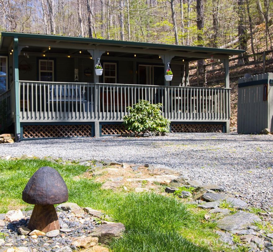 Now available—this is a once-in-a-lifetime opportunity to own a truly special mountain getaway nestled in the Blue Ridge at Dancing Leaf Lane. Featuring two unique tiny homes, this charming property is perfect for personal retreats, summer escapes, or even a short-term rental investment.

Escape to this peaceful setting and let your stress melt away. Ideal for weekend getaways or extended stays, the property offers a serene, park-like atmosphere with beautiful mountain views from the living areas and deck. In the winter, enjoy mountain views, while summer brings a lush, private canopy. You can even hear the soothing sound of a nearby rushing creek from the front yard (creek is nearby, not on property).

Both high-quality modular cabins—one log and one wood— offer everything you need and more. The main tiny home features a comfortable living and dining area, a well-equipped kitchen with propane range, a full bath, and a bedroom with two closets. Step outside to the covered front porch, complete with a large built-in picnic table—perfect for enjoying the cool mountain breeze.

The second tiny home provides additional space with a bunk area, loft, and half bath, making it ideal for guests or rental flexibility. Both cabins are equipped with Buckstoves with propane as well as window units for air conditioning.

Spend your evenings gathered around the firepit with friends and family, taking in the cool mountain air and starry skies. The property also features a gated entry, shared well, 200 AMP service, and a privately maintained road. Located just 0.6 miles from the fire department, this unrestricted property offers incredible versatility and potential.

Whether you're seeking a peaceful escape, a summer retreat, or an income-producing property, this one-of-a-kind mountain cabin experience delivers charm, comfort, and endless possibilities.