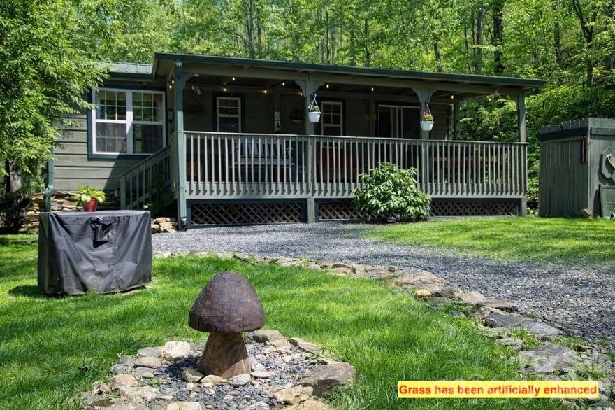 Now available—this is a once-in-a-lifetime opportunity to own a truly special mountain getaway nestled in the Blue Ridge at Dancing Leaf Lane. Featuring two unique tiny homes, this charming property is perfect for personal retreats, summer escapes, or even a short-term rental investment.

Escape to this peaceful setting and let your stress melt away. Ideal for weekend getaways or extended stays, the property offers a serene, park-like atmosphere with beautiful mountain views from the living areas and deck. In the winter, enjoy mountain views, while summer brings a lush, private canopy. You can even hear the soothing sound of a nearby rushing creek from the front yard (creek is nearby, not on property).

Both high-quality modular cabins—one log and one wood— offer everything you need and more. The main tiny home features a comfortable living and dining area, a well-equipped kitchen with propane range, a full bath, and a bedroom with two closets. Step outside to the covered front porch, complete with a large built-in picnic table—perfect for enjoying the cool mountain breeze.

The second tiny home provides additional space with a bunk area, loft, and half bath, making it ideal for guests or rental flexibility. Both cabins are equipped with Buckstoves with propane as well as window units for air conditioning.

Spend your evenings gathered around the firepit with friends and family, taking in the cool mountain air and starry skies. The property also features a gated entry, shared well, 200 AMP service, and a privately maintained road. Located just 0.6 miles from the fire department, this unrestricted property offers incredible versatility and potential.

Whether you're seeking a peaceful escape, a summer retreat, or an income-producing property, this one-of-a-kind mountain cabin experience delivers charm, comfort, and endless possibilities.