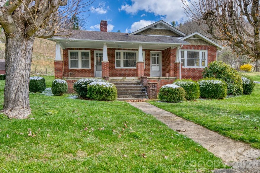 Tucked into the rolling landscapes of Western North Carolina, this classic 1940s brick home sits on just over 11 unrestricted acres — a rare find that blends historic character with genuine mountain freedom.

Original hardwood floors, three bedrooms, and generous natural light give the interior a warmth that's hard to replicate. The bones are solid, the charm is undeniable, and the canvas is yours.

Step outside and the land tells its own story: a mountain backdrop that shifts beautifully with every season. No restrictions means no limits on what this property can become — a private retreat, a homestead, a family legacy.

The front porch alone is worth the drive! 

Call today for your private viewing. Prequal req. to show.