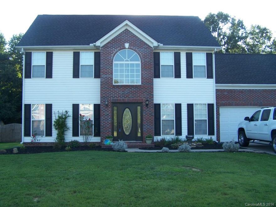 Updated with new laminate up & down - no carpet - allergy free living - new ceramic tile in baths - updated lights fixtures - remodeled 1/2 - new roof in 20013- new HVAC system in 2011 -recent custom paint colors - great open flow - kitchen w/ bar and new tile backsplash- Master has walk in closet and separate shower and large relaxing tub  w/double sinks - Bonus can be 4th bd - -patio in rear with line of trees in rear for privacy - 
move in ready