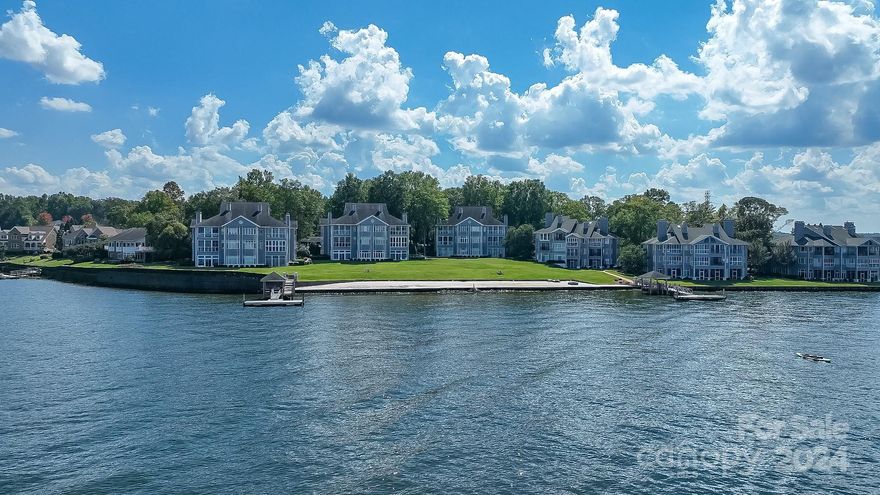 Rare Opportunity to Enjoy Long Range, Waterfront Views!!! Resort Lifestyle & Fabulous Amenities Minutes from Charlotte! NO STEPS Outside or Inside!!! 3 Bedrooms, 3 Full Baths. Low-Maintenance Living. Lakefront Views in Foyer, Kitchen, Dining, Great Room, Sunroom & Primary! Elegant Crown Molding. 10' Ceilings. Spacious Great Room w/Fireplace Opens to Fabulous Sunroom Enjoyed All Year! Floor to Ceiling Windows for Stunning Water Views! Crank-Out Windows for Cool Breeze & Sounds of Water Anytime! Imagine your Breakfast, Coffee, Candlelight Dinners & More w/"Million Dollar Views"!!! Well Appointed Kitchen w/Roll-out Shelving, Stainless Appliances, Granite, Large Island, Counter Seating, Sitting Area, Bay Window, Dining Area, Large Pantry Closet! Large Primary Suite w/Sitting Area, Water Views & Entry to Sunroom. Pool, Tennis, Playground, Beach, Firepit, Day Docks, Multiple Grills, Picnic, Rec Spaces, HOA rents limited Boat/JetSki/Kayak Trailer Storage. Marina next door rents slips.