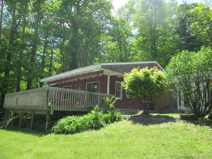 Mid century bungalow with unfinished master bedroom addition. Large double carport with storage closets. Features include large front deck overlooking winter views, 2BR, 2BA, kitchen with breakfast bar into dining/living room combo. Wood and tile flooring.