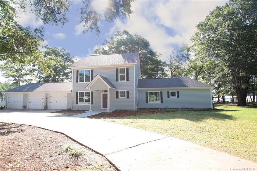 Rare opportunity to be part of a custom build project on Lake Wylie! Unique, level lot resides on deep waters in a gorgeous, open cove just off Big Allison. Oversized decks, boat house and floating docks are grandfathered. Approx. 225 feet of shoreline, two beaches and remarkable year round views. Custom cabinetry, granite, hardwoods, ceramic tiles with 9ft ceilings on main and upper level. 30x40 3-bay garage with 4th bay door and ramp for boat storage. Home is not part of HOA. Clover schools.