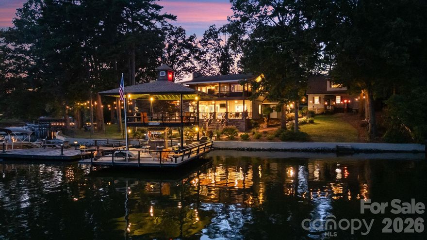 Lakefront EXTENSIVELY remodeled Home! Double Lot w/ 2nd Living Qtrs & Double-Deck Dock/Gorgeous LONG range VIEWS w/ manicured irrigated lawn & landscaping/Outdoor UPPER-LEVEL HOT TUB! PLUS 846 HTD sq ft 2.5 car detached garage PLUS 633 HTD sq ft apartment up + FULL BATH! Custom Plantation Shutters/Level 4 granite, matching lighting w/ copper sink & outdoor gas lights on stone pillars! Tankless water heaters! Garage/Apartment excellent for entertainment/AirBnB/Camper hookup for guests! Partial steel Frame home! HOT & COLD water outside for washing your TOYS! Deep water year around, excellent lighting, tiki bar, dock w/ power & water/16+ ft at full pond! Four porches, with TVs & can entertain 35 to 45 comfortably! Porches have moisture shield material & ducks-back flooring, stamped concrete. Upper screened porch - primary bedroom!  Great fishing - release area from fishing tournaments nearby! Minutes from public boat launch & lakeside fuel for easy watercraft adventures.