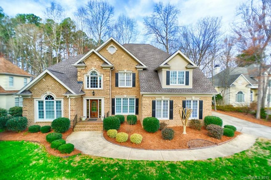 5 BR brick home meticulously maintained by original owners situated on a private cul-de-sac lot w/seasonal waterview, plantation shutters, UV window film, surround sound, custom built-ins. 2 story Great RM w/wood burning FP. 2011 kitchen reno by Simonini w/center island, granite & ss appl's (Subzero Refrig, Wolf & Viking). Master BR on main w/ bay window & updated bath.  570 SF deck overlooks huge level backyard w/8 zone inground irrigation. Walk to yacht club & park. Lake access & country club.