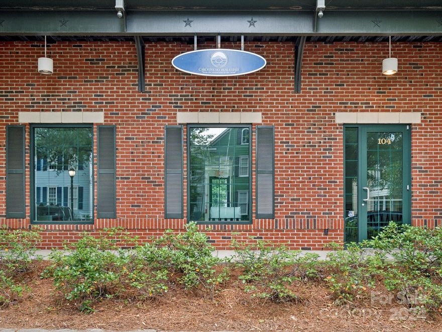 Charming commercial building nestled in the heart of Fort Mill in BAXTER VILLAGE.  Main level unit. Walking distance to dining, shops, businesses, and a vibrant live, work, play community. Updated with new flooring, fully painted including doors and molding. Built-in banquette benches have been added as well as bar height wrap around desk-top bar space.  Property has a large entry space with seating for conferences, work stations, or team meetings.  Open concept with lots of natural light. There are three additional rooms that can be closed off for private offices or additional conference rooms.   Additional locked storage closet with updated custom shelving added. Spacious bathroom.  Parking is available in both the front and back of the unit.  Front door has a covered porch, back door has zero gravity entry.  Check HOA docs for use of space as there are restrictions for restaurants and clothing/boutique-type shops.