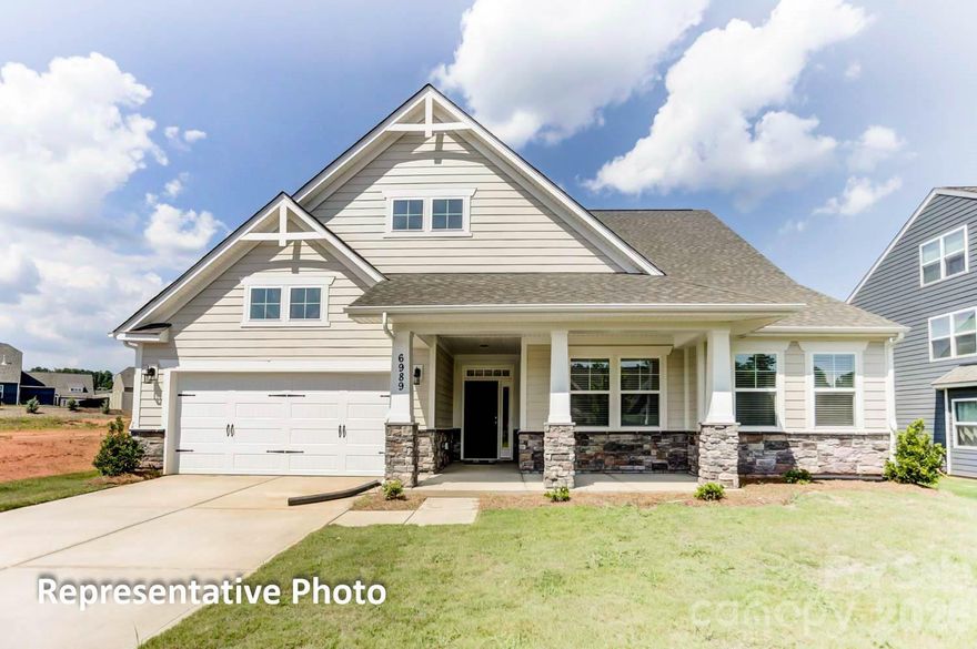 This 1.5-story Sullivan offers 4 bedrooms, 3.5 baths, and more than 2,700 square feet of living space. The main floor has more than 2,100 square feet and includes primary suite with tray ceiling and luxury shower, two additional bedrooms, an office with French doors, a mud room with drop zone, a half bath, and laundry room with cabinets and a sink. The family room/kitchen/breakfast area is a wonderful gathering space. The designer kitchen features white cabinets with a contrasting island, quartz counters, tile backsplash, a shiplap range hood, and stainless appliances, including a gas cooktop. The upper floor has a large loft, along with a bedroom and full bath with tub/shower combo. The rear of the home features a spacious covered porch. Other extras include a foyer with tray ceiling, tankless water heater, and Craftsman-style wood trim. Visit today!