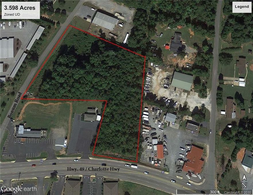 Large 3.598 acre lot with UD zoning and frontage on Hwy 49 and Bonum Road, county utilities in front on Bonum Road has endless possibilities for development.