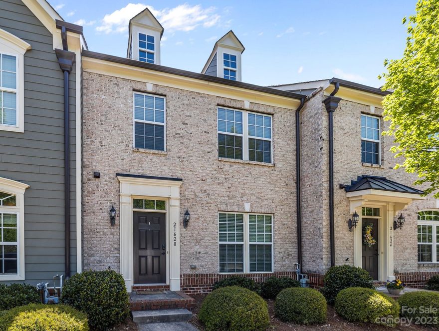 This is the ONE!!! Like new with wood flooring throughout main level, 42" Maple Cabinets, Granite, Stainless Steel Appliances & New Carpet upstairs. Lovely kitchen opens to the breakfast/dining area and living room. Front room can serve as a dining room, an office, or flex space! 

Large fenced patio & 2 car detached garage!.Short distance to Greenway, Pool, Dog Park, & Walking Trails. This townhome is located on a premium lot facing the Dog Park. Easy access to grocery, restaurant & retail - all LKN has to offer as well as downtown Davidson & Cornelius!

Garage Door & Water Heater recently serviced. New Condenser & New Exterior A/C unit 2022.