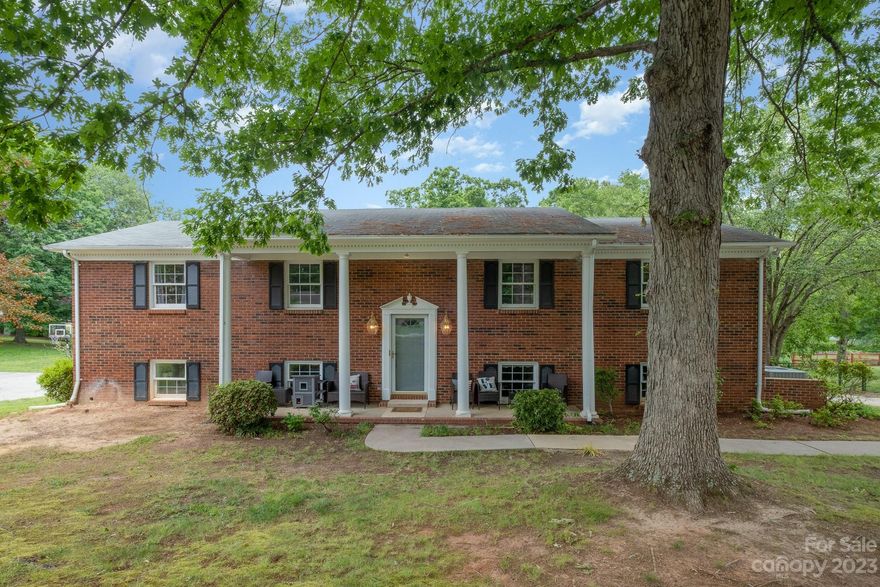 Enjoy indoor and outdoor living at this stately home near Lane St/ I-85/ US 29 and downtown Kannapolis. A new 3 ton American Standard HVAC and Honeywell wifi thermostat was installed 7/22. Dishwasher and disposal replaced in 2022. A new stainless induction/convection/air fryer stove/oven installed 2022. New stainless faucet with soap dispenser installed in kitchen. New Kohler toilet installed in primary bathroom. A new ceiling fan installed in the primary bedroom. Sewer drain from house to trap was replaced in 2022. Water line to ice maker was replaced in 2022. A wood burning fireplace is located in the den and a wood burning stove in the lower bonus room. Mature trees adorn this lot and there is plenty of space for gardening and outdoor projects. Tons of storage can be utilized in the utility room and a utility closet underneath the stairwell. Back on market, inspection report available.