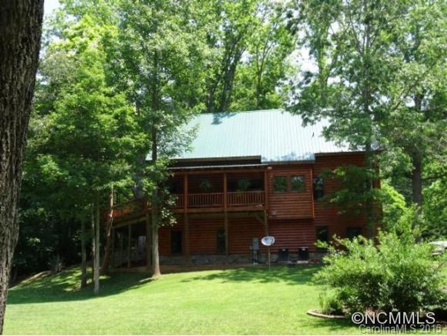 Immaculate custom log home with open floor plan, lots of windows, cathedral ceilings, native stone FP, 2 car drive in garage, & the property is just as amazing! Huge pond stocked with catfish, creek borders property with small waterfall, lots of shade trees, & so peaceful!Wonderful sun deck for entertaining overlooking the pond.