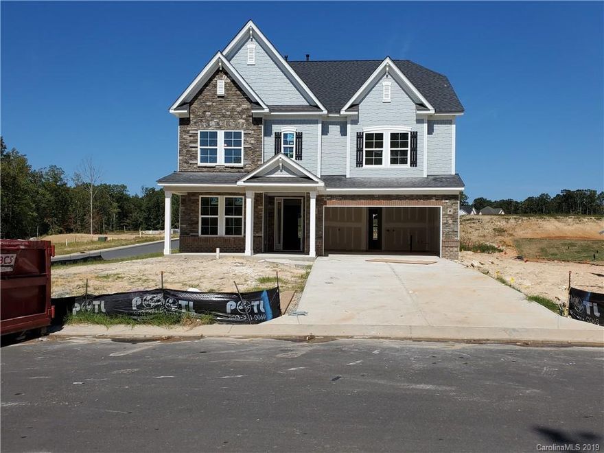 European Waverly floor plan on a nice corner homesite, features include a screen rear porch and a covered front porch, Mohawk Rev Wood floors in foyer, Dining Room, kitchen, breakfast, pantry, family room, 2nd floor hall and loft, hardwood stairs, On Demand gas water heater, guest suite on main, Trey ceiling in master and DR, owners bath features a walk in shower, 36 " Gas Cook top , with wall oven. close to everything ,