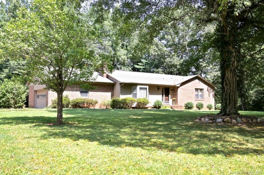 Enjoy your own 3+ acres AND single level living!Large, vaulted great room with rock fireplace with corner bar area.Kitchen with eating area & doors to deck! Laundry room off kitchen! 2 full baths with large tubs!Huge garage! Architectural shingles! 24x24 shop in backyard! Grape vines! Privacy and space are yours! Easement to be granted in the rear of property to neighbor.